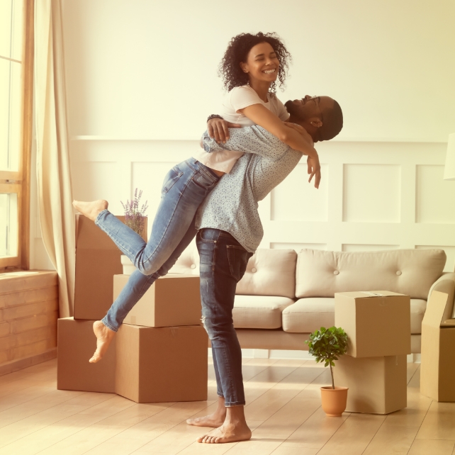 A couple excited to move into their new rent to own home