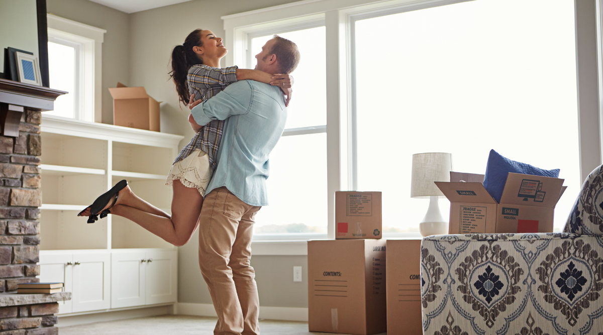 A couple in their home after starting the rent-to-own process