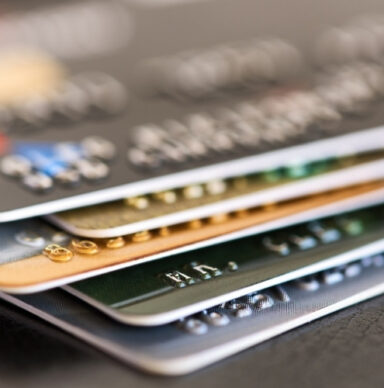 Pile of credit cards showing a strong credit mix for better credit scores.