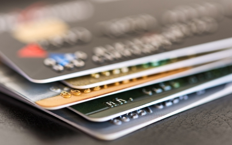 Pile of credit cards showing a strong credit mix for better credit scores.